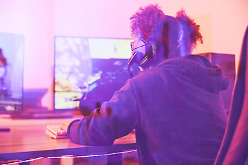 Image showing Back of girl, gamer and computer in home, desk or online games of virtual competition. Female streamer, live streaming and night gaming with headphones in neon lighting and esports technology