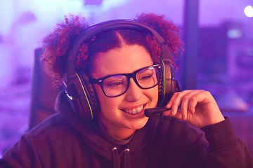 Image showing Happy gamer, teenager girl and headphones in home for esports, online games or virtual competition. Female streamer, computer live streaming and gaming for smile in neon lighting, night tech or gen z