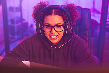 Image showing Video game, teenager girl and headphones in home for esports, online games and virtual player. Female gamer, computer live streaming and gaming with headset in neon lighting, tech and gen z streamer