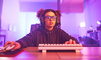 Image showing Computer video game, girl and live streaming in home for esports, online games and virtual competition. Female gamer, headphones and gaming with headset in neon lighting, cyber tech or gen z streamer