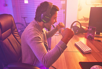 Image showing Winner, excited or man gamer on computer with microphone celebrating game win and success fist. Happy, cheering or esport player celebration for online competition, wow with progress and achievement