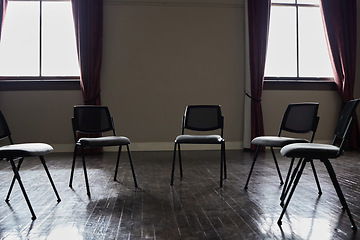 Image showing Group therapy, mental health or circle chairs in empty room, clinic or asylum building for trauma, ptsd or anxiety counselling. Furniture, support or community psychology counseling for help meeting