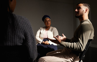 Image showing Support, man talking to women and group therapy help with understanding, sharing feelings in counselling session. Mental health, addiction and depression, people in grief together with therapist.