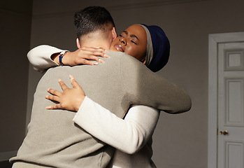 Image showing Hug, support and woman embrace a man for comfort, grief and care after bad news or problems in a home or house. Cancer, sad and depression by people hugging for empathy, love and hope together