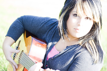 Image showing Girl Playing a Guitar