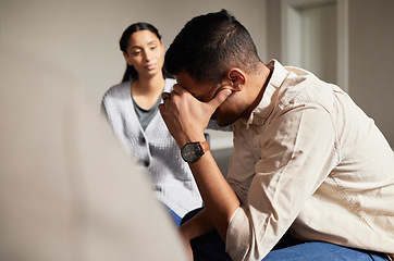 Image showing Sad group in therapy and man crying with depression, AA and addiction in an emotional meeting together for hope. Unity, trust and sharing mental health stories sitting in a circle for healing