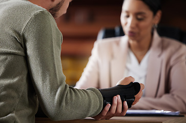 Image showing Hand injury, compensation and lawyer people with insurance, legal advice and contract meeting. Disability, accident and person in lawyer or attorney consultant for advice, agreement or policy report