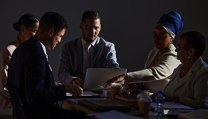 Image showing Business meeting, people and laptop for idea, goal or vision for startup, company or integration at night in office. Partnership, planning or collaboration by team discuss strategy or negotiation