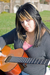 Image showing Girl Playing a Guitar