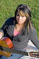 Image showing Girl Playing a Guitar