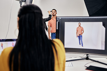 Image showing Woman, photographer and studio with man, makeup and camera for vision, fashion and magazine. Photography expert girl, focus and workspace with background, model and photoshoot for clothes design blog