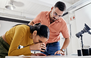 Image showing Photographer, editing and review with people in studio for creative, planning and designer. Production, process and lens with man and woman with media film for photography, teamwork and photoshoot