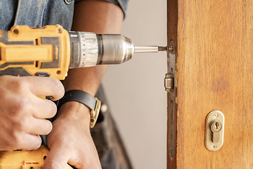 Image showing Handyman, drill door and wood for handle at workplace, industry and home development goals. Hands, tools and construction worker with maintenance, property management and diy carpenter for building