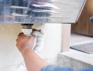 Image showing Handyman, plumber hands and pvc pipe for water system efficiency, drain and maintenance outdoor. Diy home improvement, plumbing service and expert construction worker with building renovation job