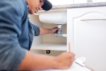 Image showing Plumber, checklist and pipe in home kitchen, workplace or industry for property development vision. Black man, construction worker and writing with notes, idea and paper for diy, interior and design