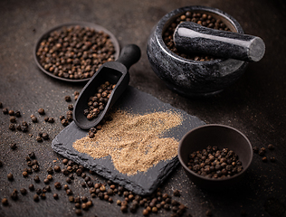 Image showing Whole and milled black pepper
