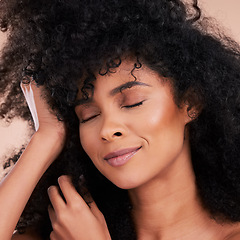 Image showing Beauty, hair and skincare of black woman in studio for self care with shampoo and cosmetics. Face of aesthetic model person with natural afro and facial makeup glow or shine for health and wellness