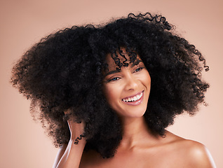 Image showing Hair care, black woman and curly texture of a young model with a healthy afro from salon treatment. Happy face, cosmetics and African person with wellness, skincare and smile from beauty in studio