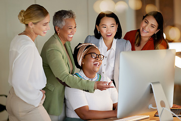 Image showing Collaboration, laughter and a business manager with her team, working on a computer in the office at night. Teamwork, diversity and coaching with a senior woman leader training her staff at work