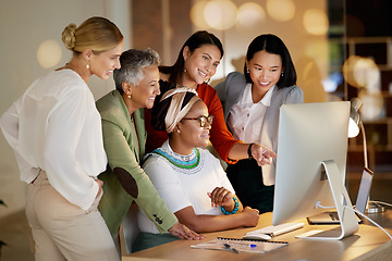 Image showing Computer, management and a business woman with her team, working on a deal in the office at night. Collaboration, diversity and coaching with a senior female manager training her staff at work