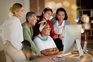 Image showing Computer, meeting and a business woman with her team, working online in the office at night for development. Teamwork, diversity and coaching with a senior female manager training her staff at work