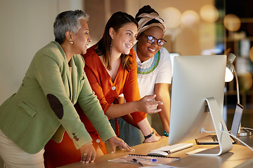 Image showing Computer, business and a female leader with her team, working overtime together in the office at night. Collaboration, diversity and coaching with a senior woman manager training her staff at work