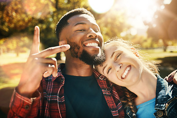 Image showing Couple smile, selfie peace sign and portrait outdoors, enjoying fun time and bonding at park. Interracial, love romance and black man and woman with v hand emoji for taking pictures for happy memory.