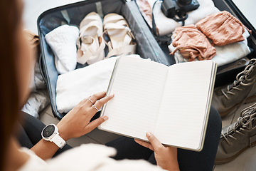 Image showing Travel, suitcase and notebook with hands of woman for planning, vacation and packing clothing. Journey, luggage and adventure with journal planner and traveller for holiday, tourism and abroad trip