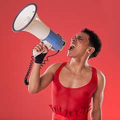 Image showing Anger, gay and a man with a megaphone for protest isolated on a red background in a studio. Lgbt, freedom and person shouting and talking into a speaker for gen z rights and voice or riot on backdrop