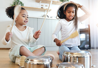 Image showing Girl children, kitchen and drums with pot in black family home, happiness and comic bonding on holiday. Young kids, sisters and happy for comedy music, joke and excited in morning for playful friends