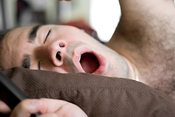 Image showing Man Yawning In Bed