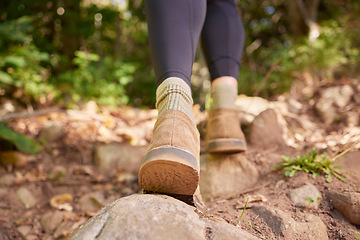 Image showing Ground, woman shoes and hiking in forest, nature and rock path for wellness, exercise and outdoor adventure. Hiker girl, boots and freedom in woods, forrest and walk to explore landscape on holiday