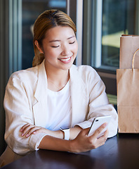 Image showing Phone, shopping and Asian woman in restaurant with smile for product deal, ecommerce and sale. Technology, fashion and happy girl on smartphone for text message, social media and website in mall