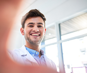 Image showing Doctor, man and portrait smile for selfie, profile picture or vlog on the job in healthcare at the hospital. Happy male medical professional smiling for photo, memory or social media post at clinic