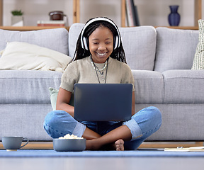 Image showing Black woman, student and laptop with smile for elearning, education or entertainment by living room sofa at home. Happy African American female learner smiling on computer sitting by couch on floor