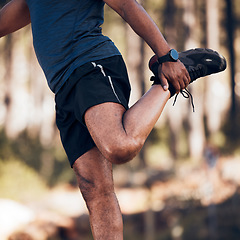 Image showing Black man, stretching legs and exercise outdoor in nature forest for fitness and healthy lifestyle. Sports person doing workout, training and muscle warm up for cardio body health and wellness