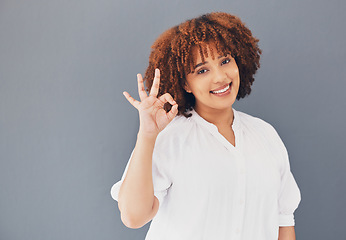 Image showing Happy. perfect and portrait of a black woman with a hand isolated on a grey studio background. Business, okay and African employee with an emoji sign for happiness, approval and work satisfaction