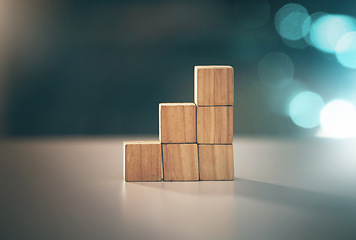 Image showing Building, investment and blocks for business, planning and strategy with stable foundation on a table. Growth, creative and conceptual design for economy, value and finance interest on a desk