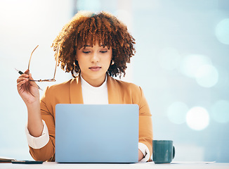 Image showing Black woman, business and laptop with glasses reading email and working online in office. Entrepreneur person at desk with technology and bokeh mockup space for career research and data analysis