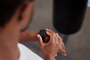 Image showing Fitness, gym and hands with smart watch for time, health app or tracking wellness goals. Sports, training and black man or athlete using digital technology for monitoring workout or exercise targets