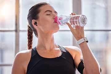 Image showing Fitness, drinking water and woman in gym for health, wellness or hydration. Sports, nutrition or thirsty female athlete with liquid after training, workout or exercise, running or cardio for strength