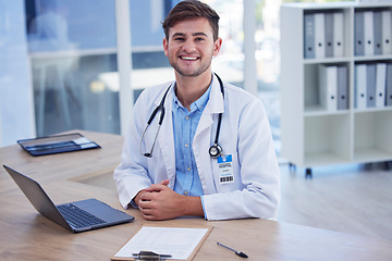 Image showing Man, doctor and portrait smile with laptop for healthcare, Telehealth or research at office desk. Happy male medical professional smiling by computer for medicare innovation or development at clinic