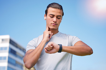 Image showing Fitness, running and pulse with man and watch check for training, heart rate and wellness app. Workout, exercise and health with runner in jogging in city for monitoring performance, steps or results