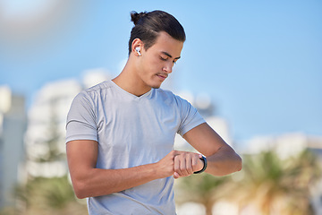 Image showing Smartwatch, fitness and man checking running, health and cardio progress while training in a city. Digital, heart and pulse tracker for guy runner outdoor for performance, monitor and exercise app