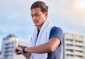 Image showing Fitness, smartwatch and man checking running, health and cardio progress while training in a city. Digital, heart and pulse tracker for guy runner outdoor for performance, monitor and exercise app