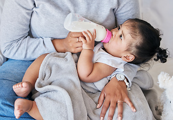 Image showing Mom feeding baby, milk formula and nutrition with drinking, family and healthy, growth and childhood development. Woman feed infant child at home, meal and hands with health and wellness