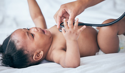 Image showing Baby, health and pediatrician hand, stethoscope and listen to heart, medical checkup and childhood development. Healthcare exam, people at clinic and growth with black girl infant and consultation