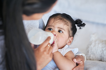 Image showing Baby drink bottle, formula and nutrition with feeding and family, healthy and growth with early childhood development. Mother feed infant child milk, people at home with health and wellness