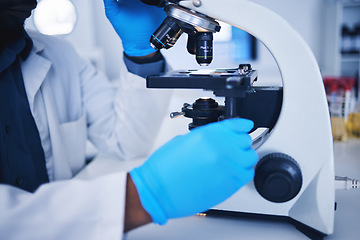 Image showing Science, microscope and hands of a scientist in a lab doing research, experiment or test. Innovation, biotechnology and female scientific researcher working with equipment to examine in a laboratory.