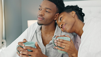 Image showing Love, couple and coffee in bed with a black woman and man in the bedroom to relax in their home. Young african american male and female drinking tea and relaxing in their house on the weekend